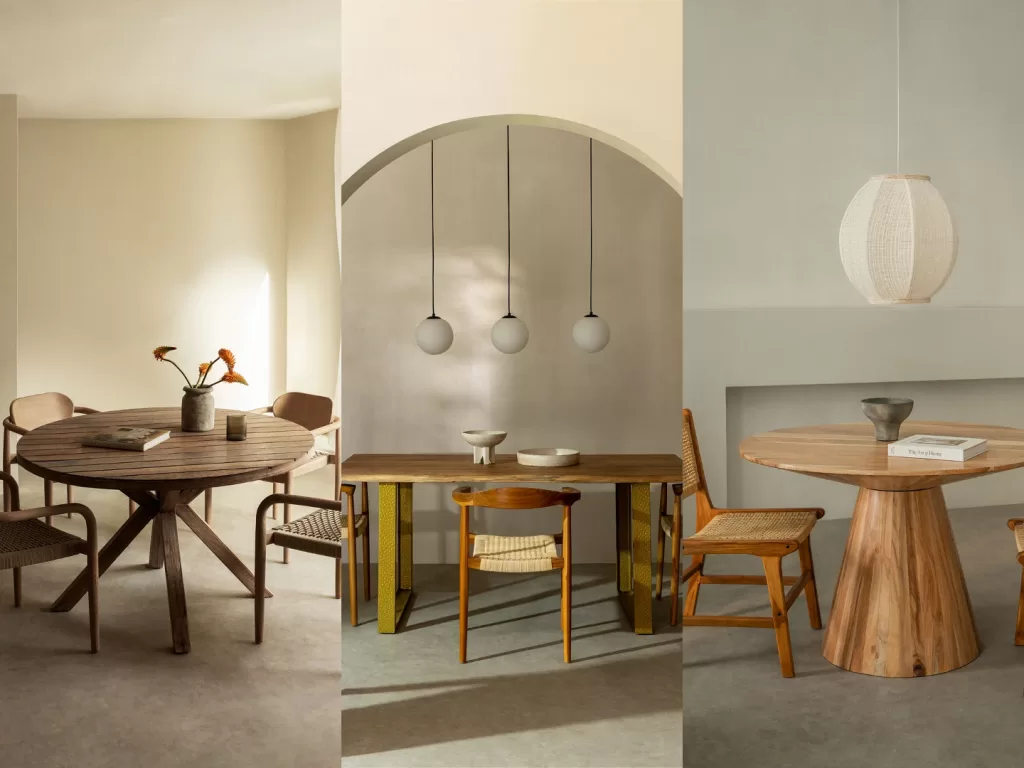 Tavola da pranzo rustica in legno con runner in lino, brocca in ceramica e candele.